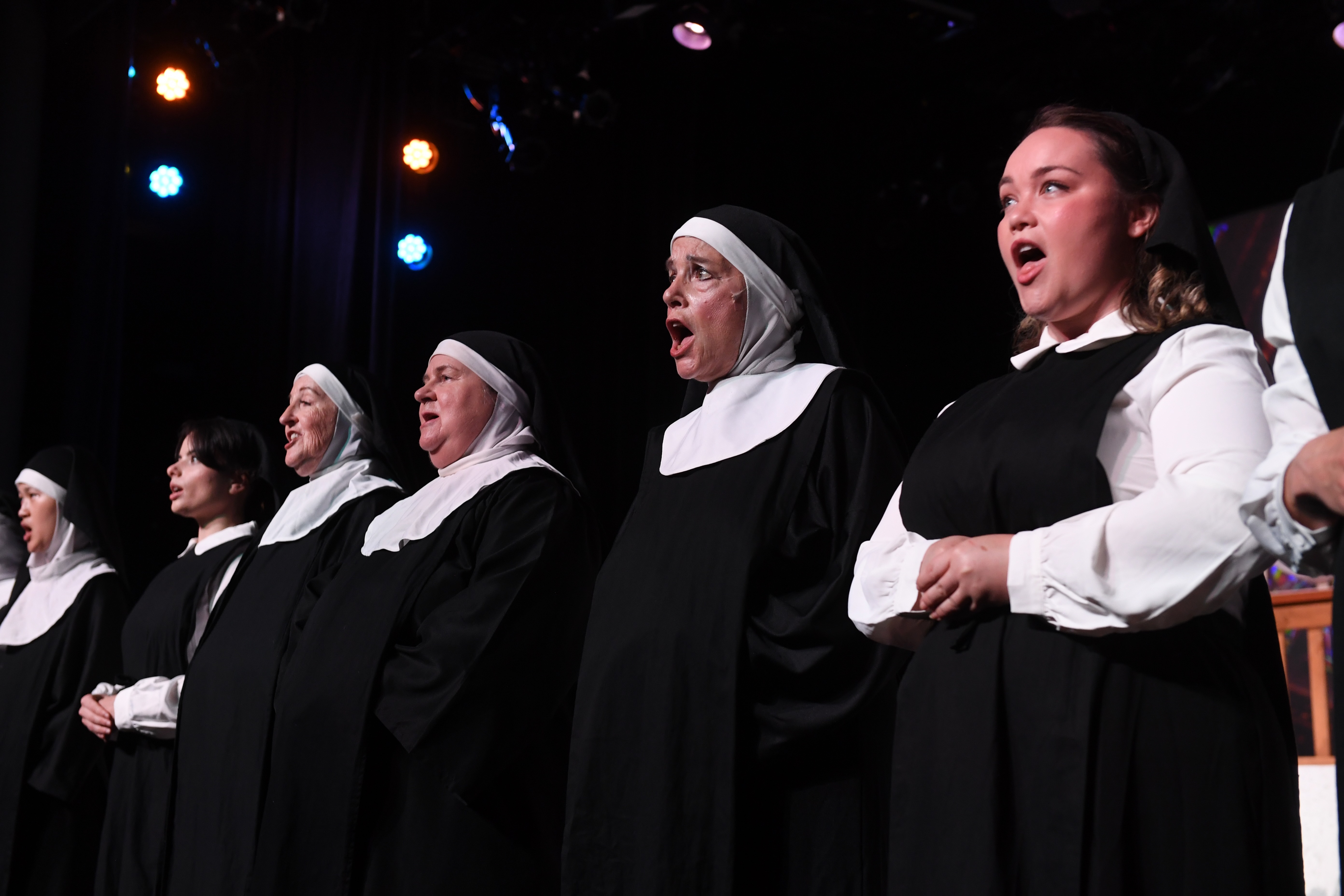 nuns in a line, singing
